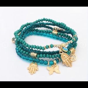 Stretchable bracelets Hamsa, and eye.